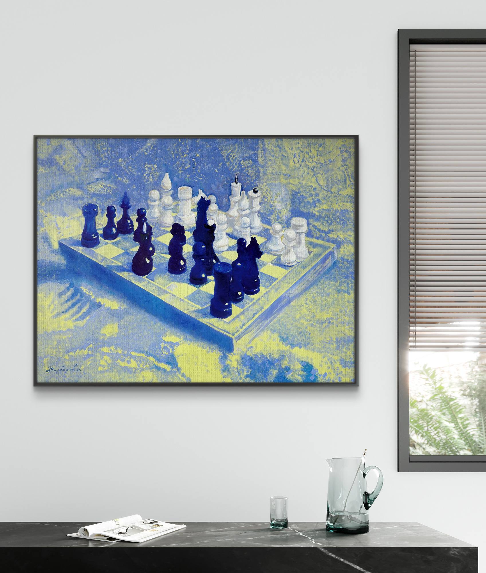 Framed abstract chess board painting on a wall with a window and table in the foreground.