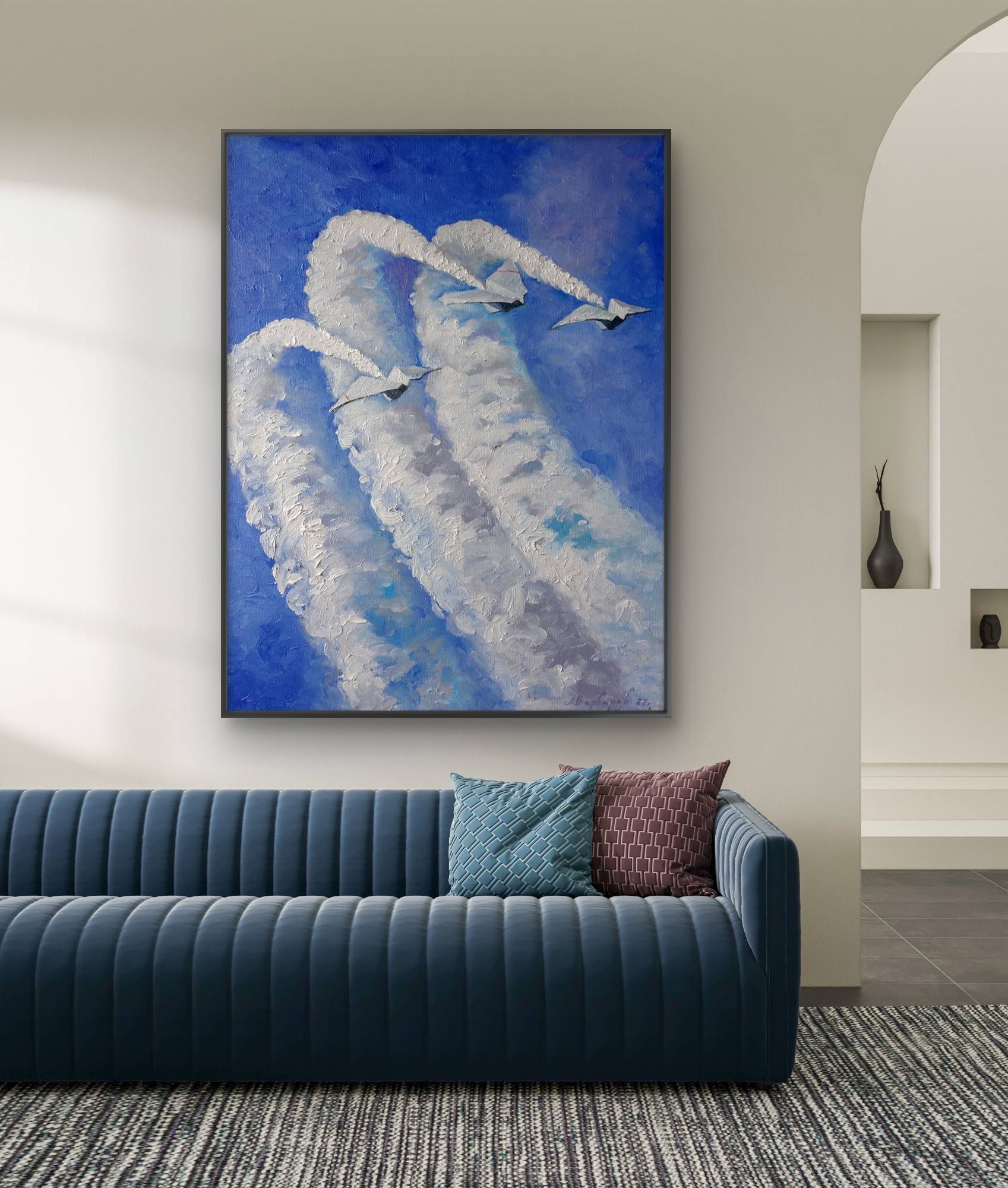 Modern living room with a blue sofa and a large abstract painting of two swans on the wall.