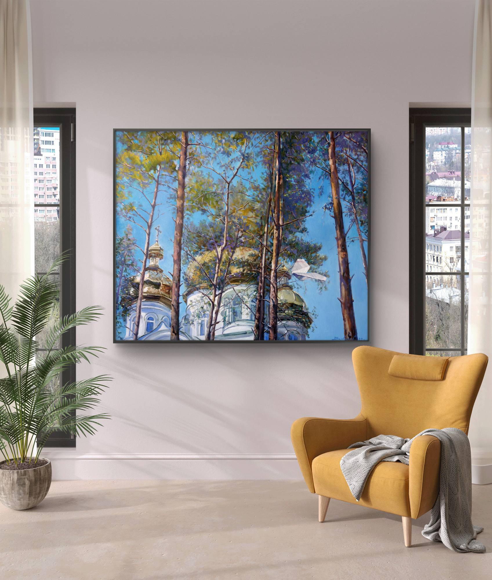 Yellow armchair in a room with a large painting of trees and a building on the wall.