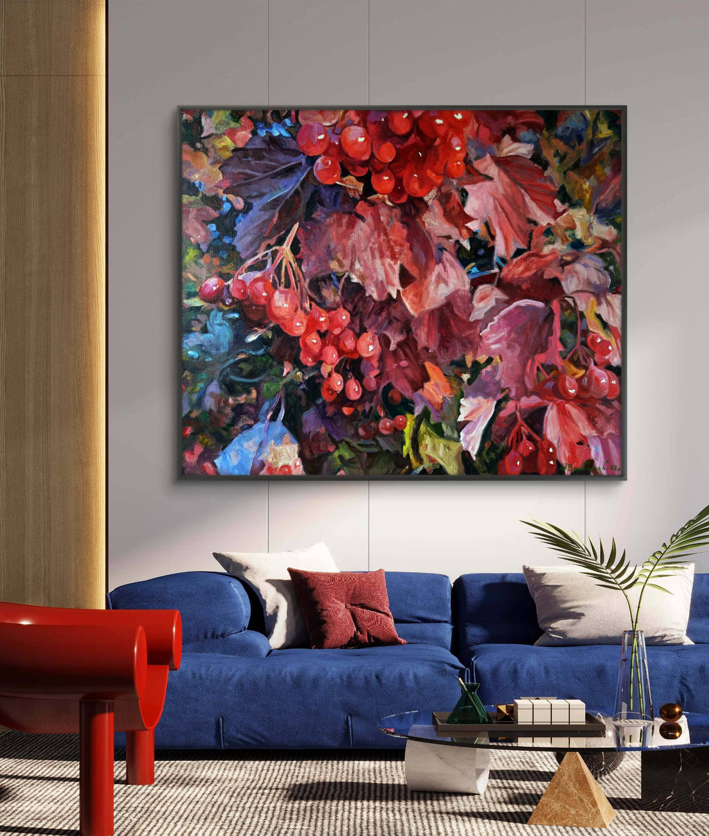 Colorful abstract painting above a blue sofa in a living room.