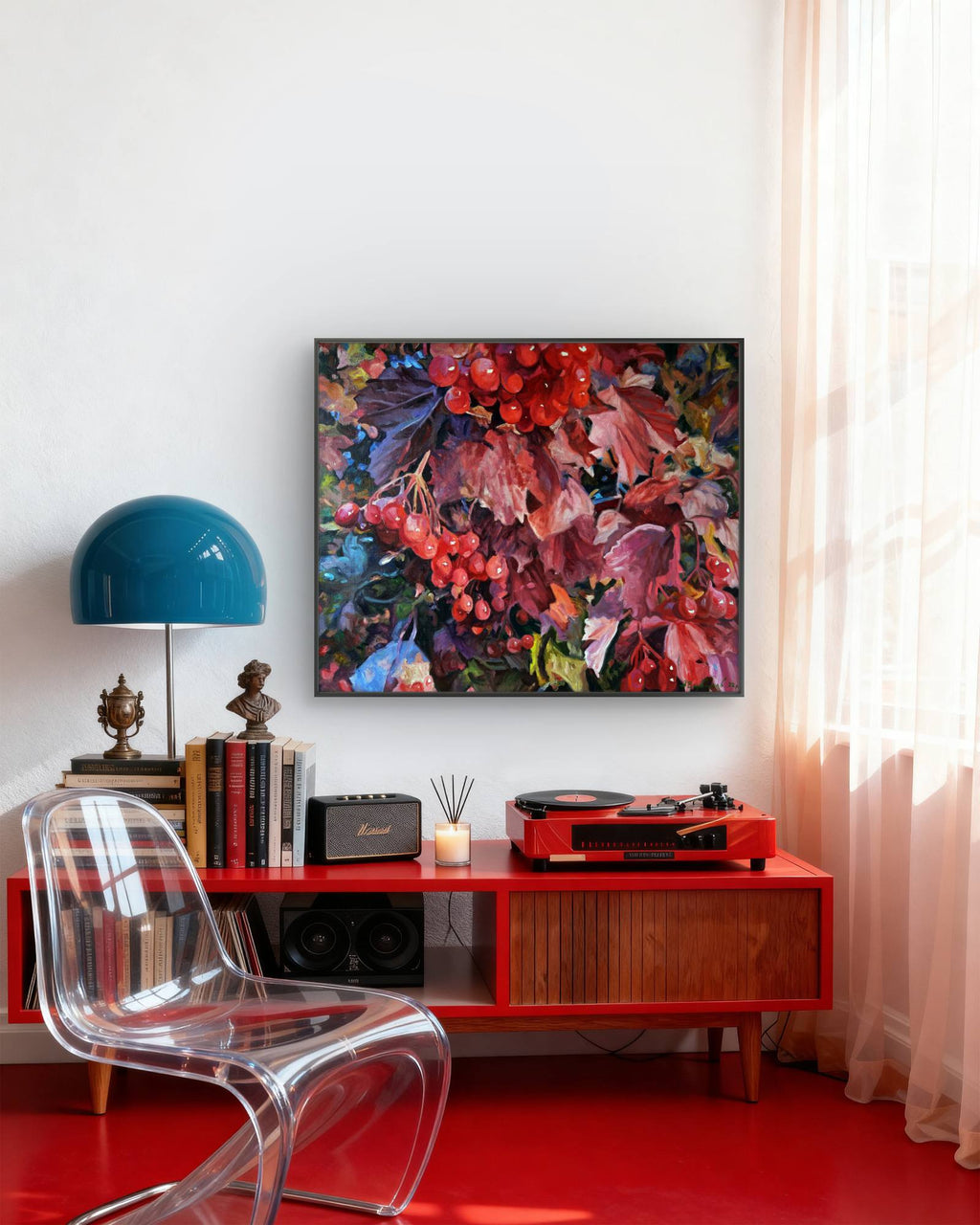 Modern living room with a red console table, clear chair, and colorful abstract painting.
