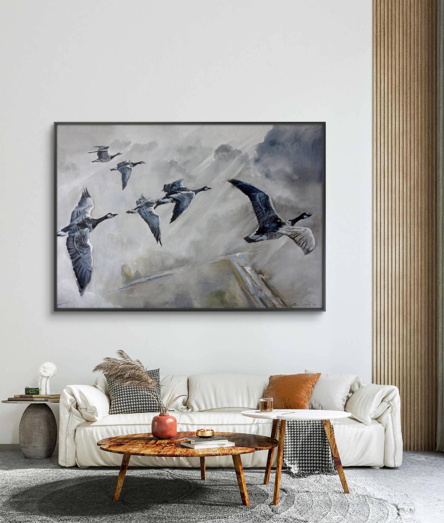 Living room with a large abstract painting of birds on the wall above a sofa.