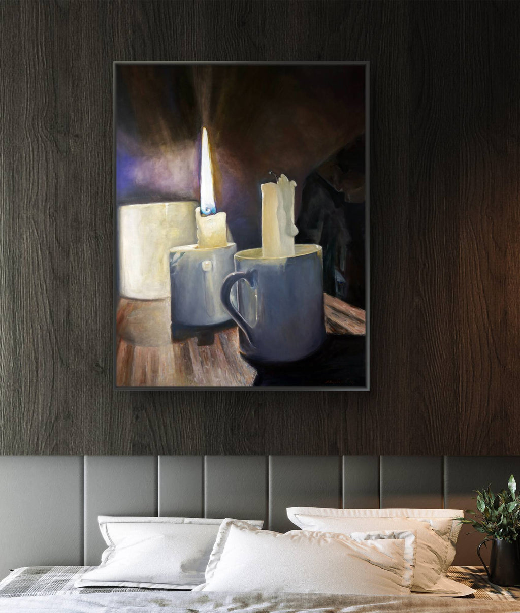 Framed abstract artwork on a wall above a bed
