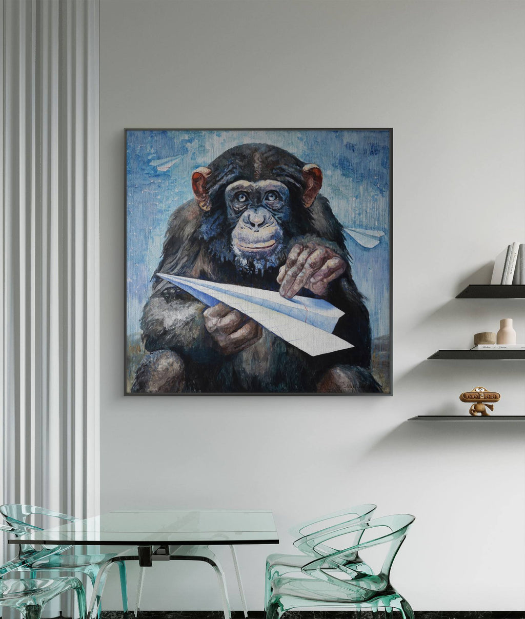 Painting of a chimpanzee holding a paper airplane in a modern interior setting.