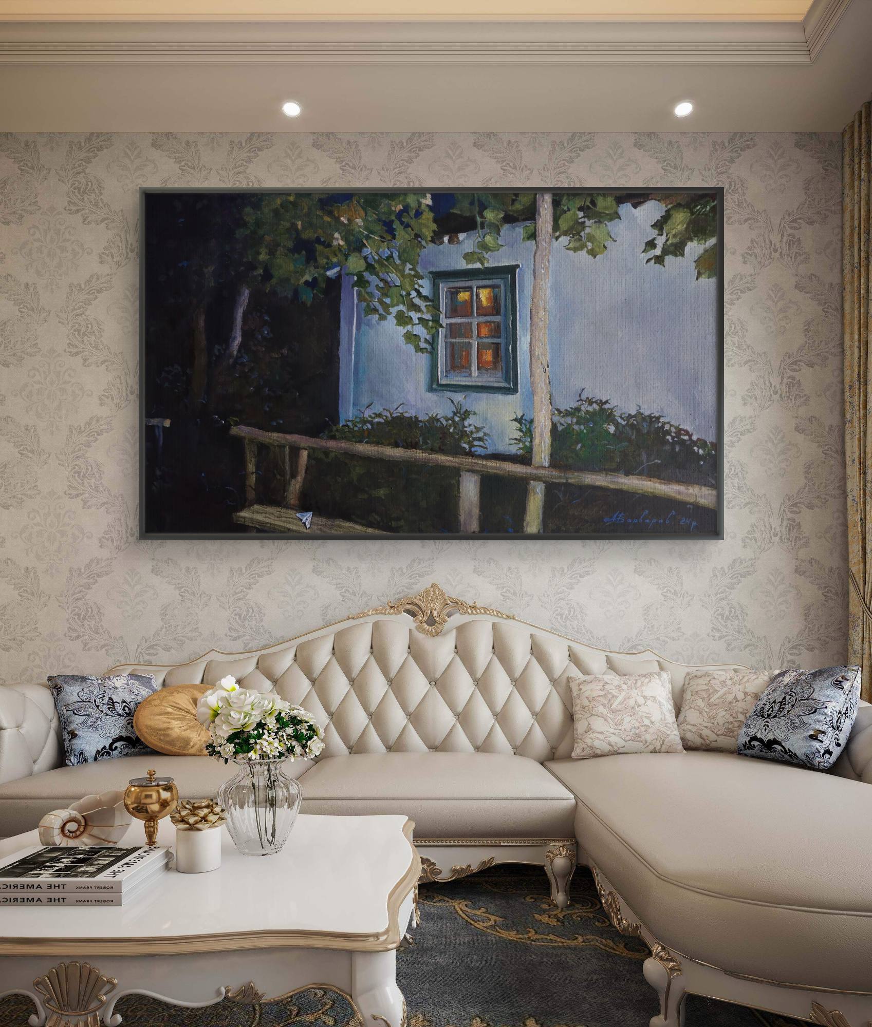 Decorative living room with a large painting on the wall above a beige sofa.