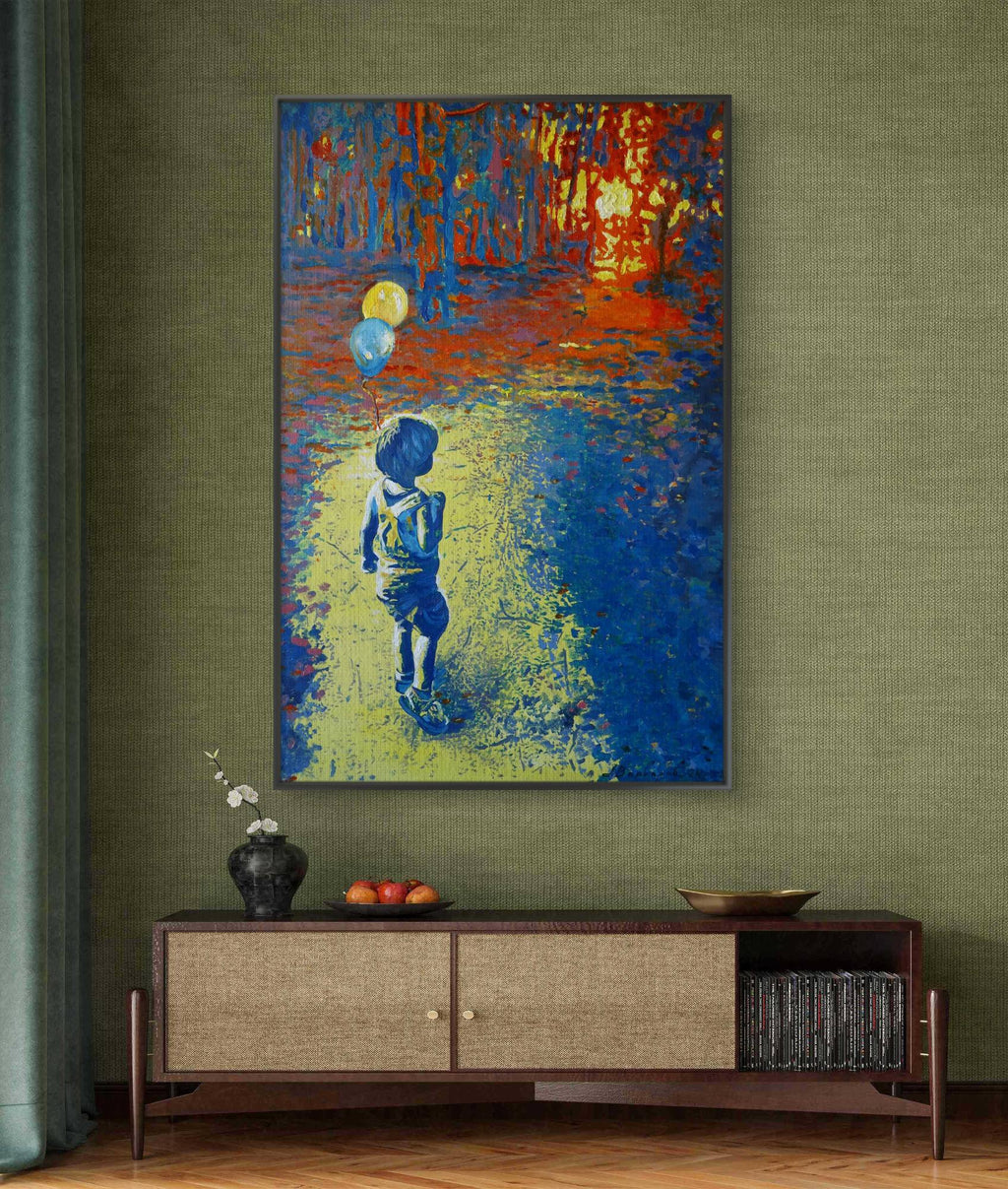 Abstract painting of a child with balloons on a green wall above a wooden console table.