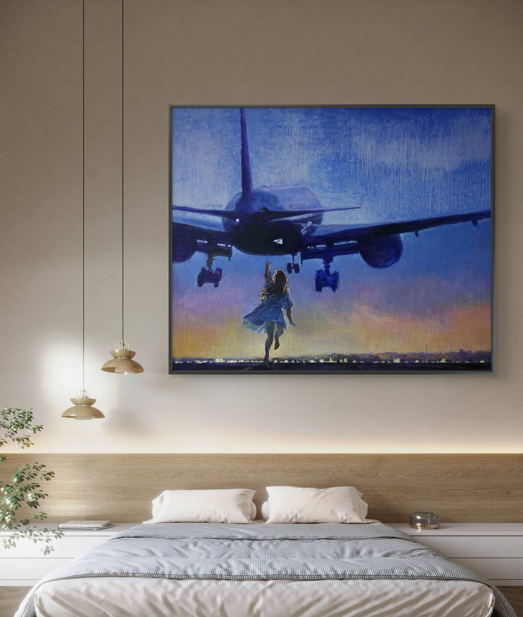 Framed artwork of a plane and person running on a wall above a bed.