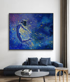 Blue abstract painting of a figure on a wall above a blue sofa in a living room.